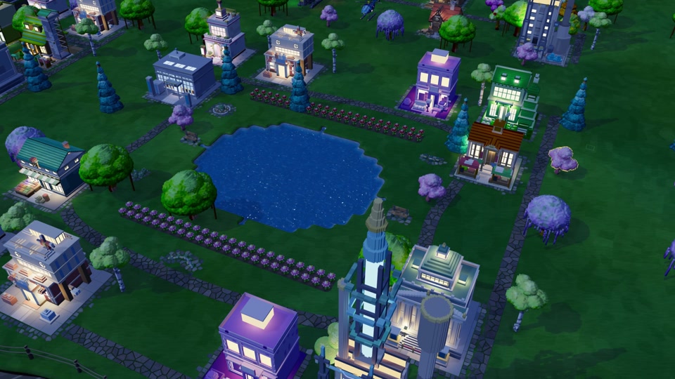 GrowIt's voxel town at night, with lit windows, flowering trees, and paths around a lake.